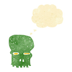 cartoon spooky skull with thought bubble
