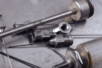 Steel medical instruments in the old tray