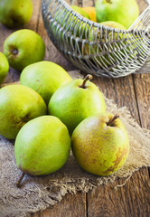 Pears on a rustic wooden kitchen table