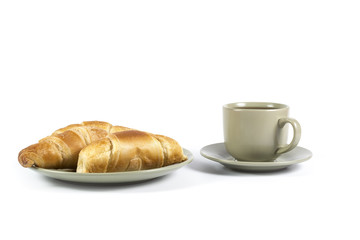 Cup of tea with fresh croissants on green plate isolated on whit