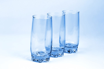 three blue transparent glass with a light blue background