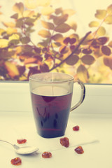 Tea and dried fruits in the window