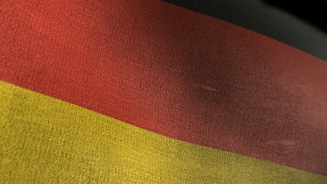 A closeup of a the national flag of germany waving in the wind