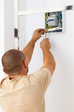 Electrician Man Fixing Fuse
