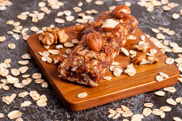 Healthy granola bar on wooden background