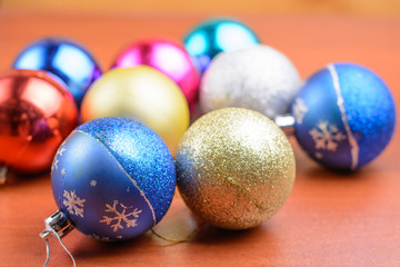 Christmas tinsel and toys on a wooden background