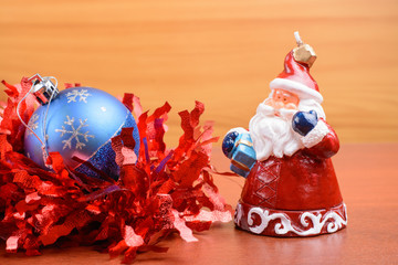 Christmas tinsel and toys on a wooden background