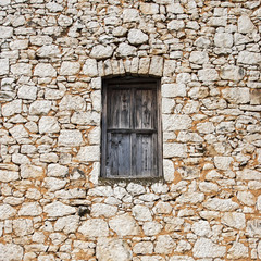 Window in the old stone wall