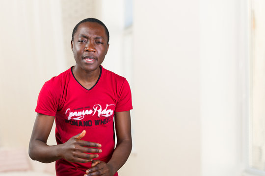 Closeup portrait of easy going clueless young man, student arms out asking what's the problem