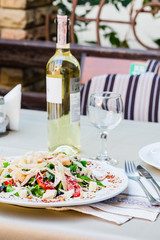 Caesar salad with chicken, cherry tomatoes, lettuce