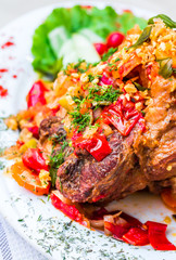 pork knuckle baked with vegetables, meat
