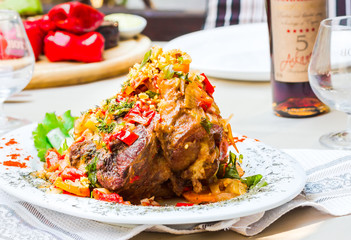 pork knuckle baked with vegetables, meat