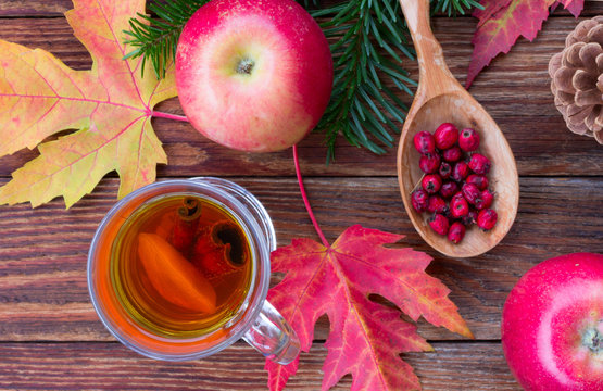tea with cinnamon and lemon, colorful autumn leaves of maple, ha