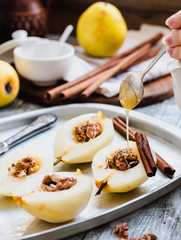 add honey to a pear with walnuts, cinnamon sticks, cooking proce