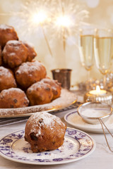 Fototapeta na wymiar Dutch New Year's Eve with oliebollen, a traditional pastry