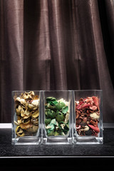 Fragrant dried flower petals in glass