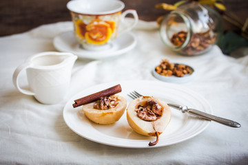 spicy baked pear with walnuts, honey, cinnamon sticks, healthy d
