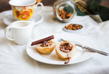 spicy baked pear with walnuts, honey, cinnamon sticks, healthy d