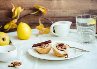 spicy baked pear with walnuts, honey, cinnamon sticks, healthy d