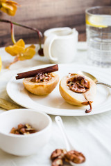 spicy baked pear with walnuts, honey, healthy dessert,selective