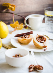 spicy baked pear with walnuts, honey, healthy dessert,selective