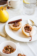 spicy baked pear with walnuts, honey, healthy dessert,selective