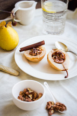 spicy baked pear with walnuts, honey, healthy dessert,selective