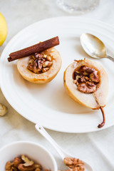 spicy baked pear with walnuts, honey, healthy dessert,selective