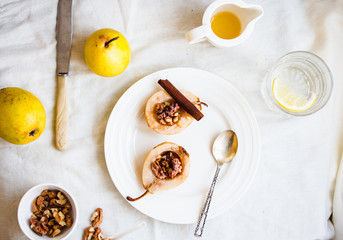 spicy baked pear with walnuts, honey, healthy dessert,top view