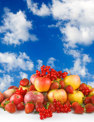 different fruits on  sky background