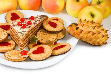 apples and sweets on  sunlight background closeup