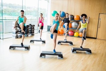 Fitness class exercising in the studio