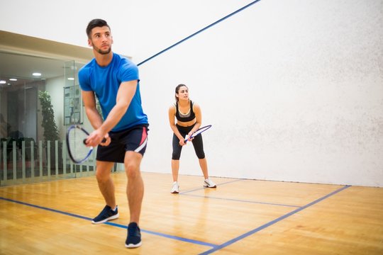 Couple play some squash together