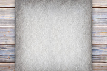 Blank paper sheet on old planks background