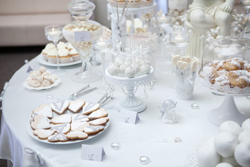 Dessert table with cake and candy on a wedding day