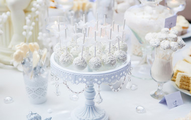 Dessert table with cake and candy on a wedding day