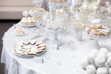 Dessert table with cake and candy on a wedding day