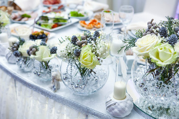 Table decor with flowers table numbers and candles