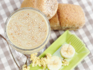 Soy milk smoothie with banana garnished with sesame seeds