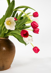 Bouquet of tulips in an old ceramic jug