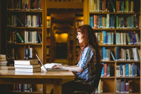 Mature Student Studying In Library