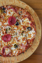 Closeup half pepperoni flat bread pizza top