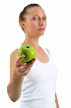 attractive athletic blondy woman with green apple