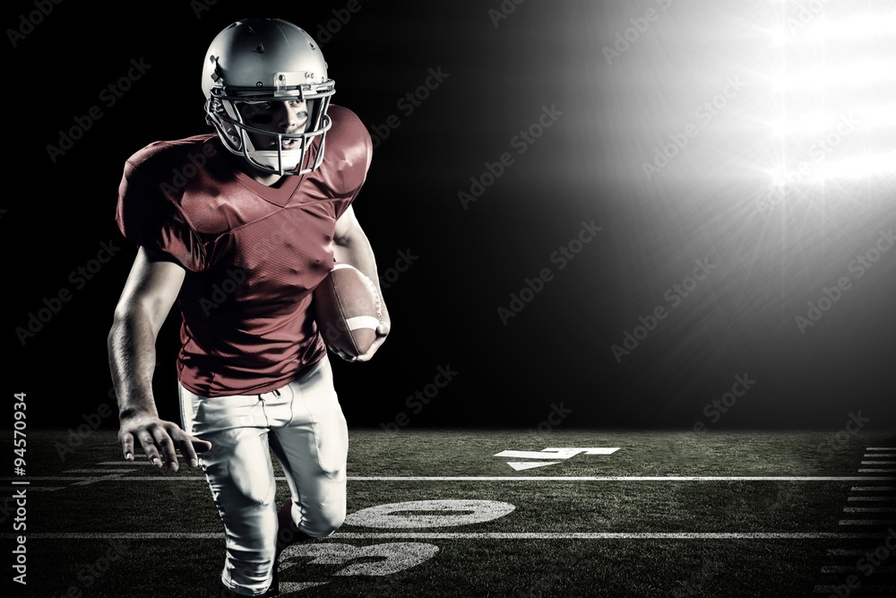 Canvas Prints Sportsman running while playing american football