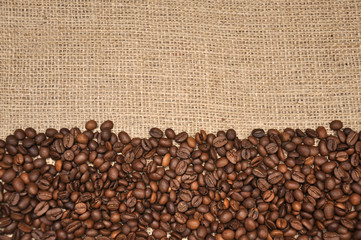 Fototapeta premium Coffee beans on a sackcloth