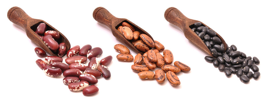 Pinto Beans In Wooden Scoops, Isolated