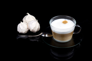 Cappuccino with meringue in a glass cup