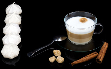 Cappuccino with meringue in a glass cup