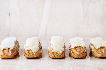 Eclairs on white marble