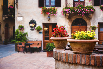 Square in front of the buildings in the medieval town in Tuscany
